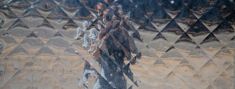 A person blurred by obscure glass